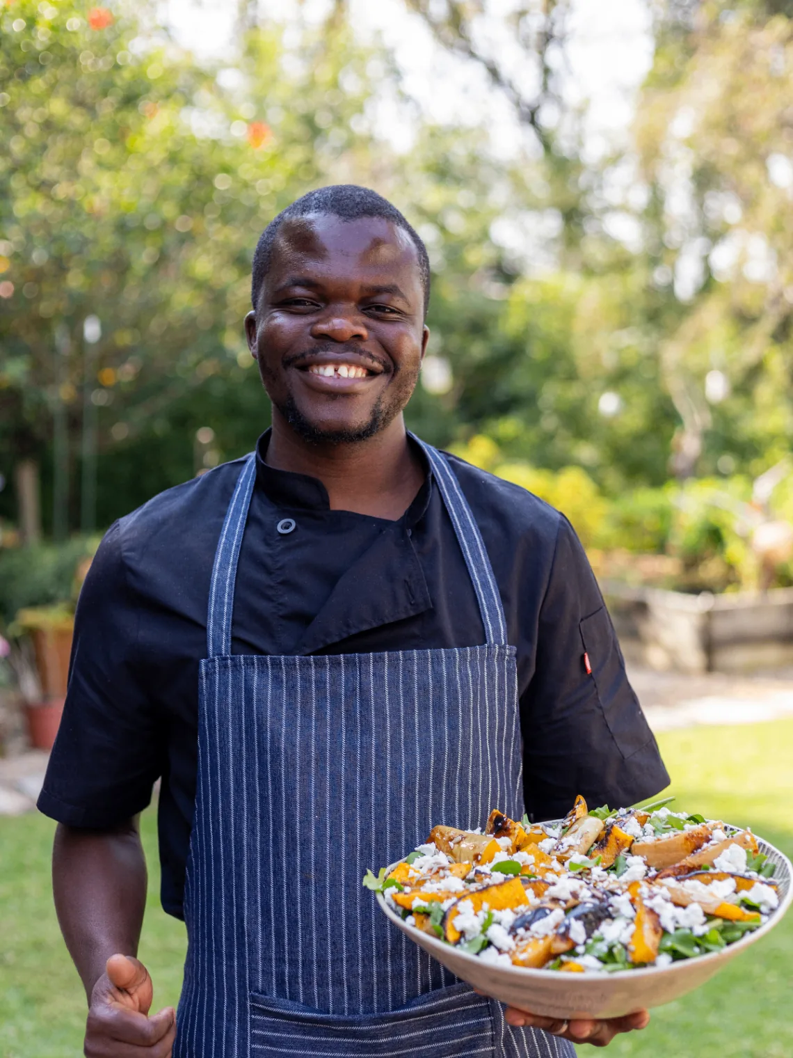 Chef presenting a fresh seasonal salad